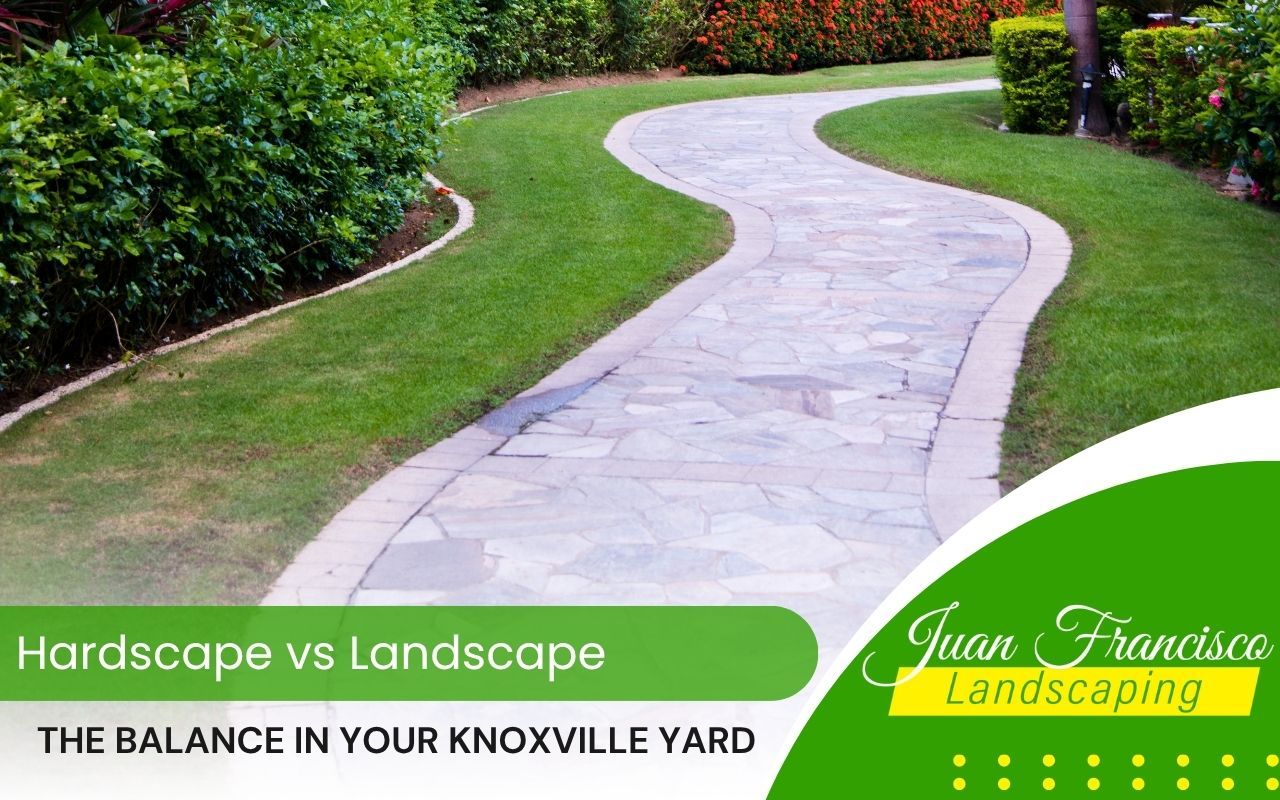 Hardscaped stone walkway beside a landscaped flower bed